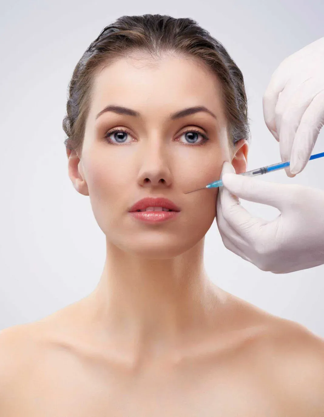 Woman receiving a cosmetic facial injection